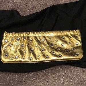 Bebe genuine leather gold evening clutch with diamond studs